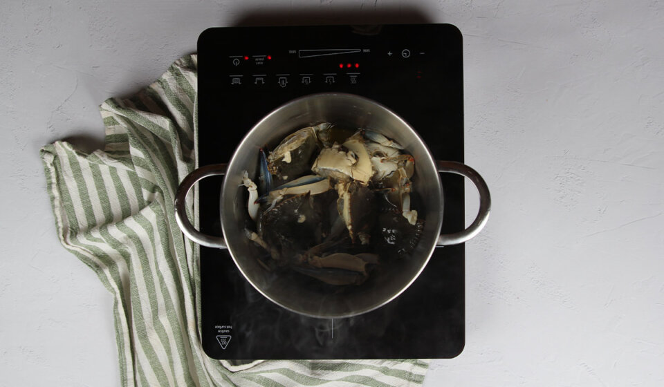 Cocinar cangrejos en Arroz con cangrejo azul